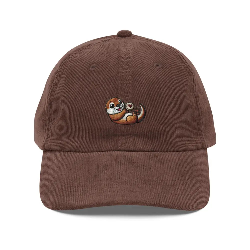 Brown corduroy cap with embroidered playful otter holding heart rock by Trini Skies
