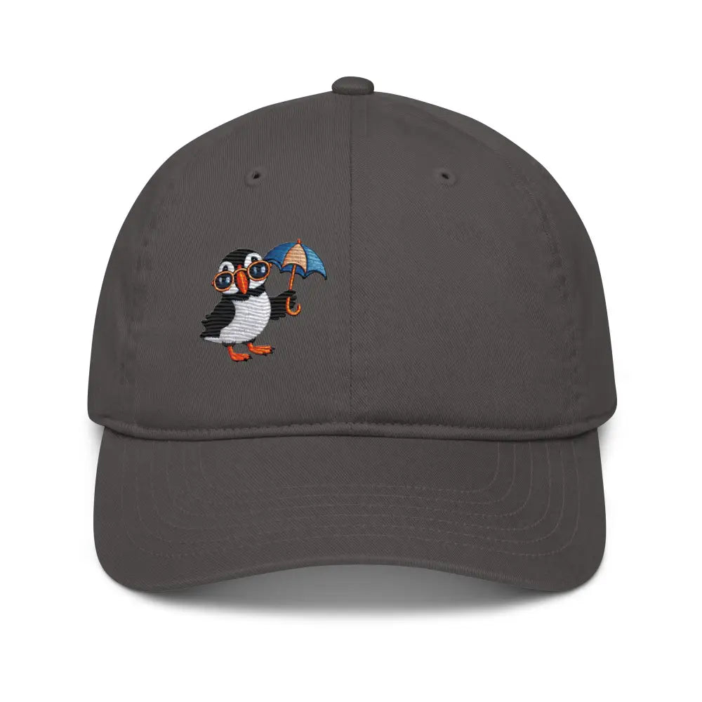 Dark gray organic dad hat with embroidered playful puffin in glasses and umbrella