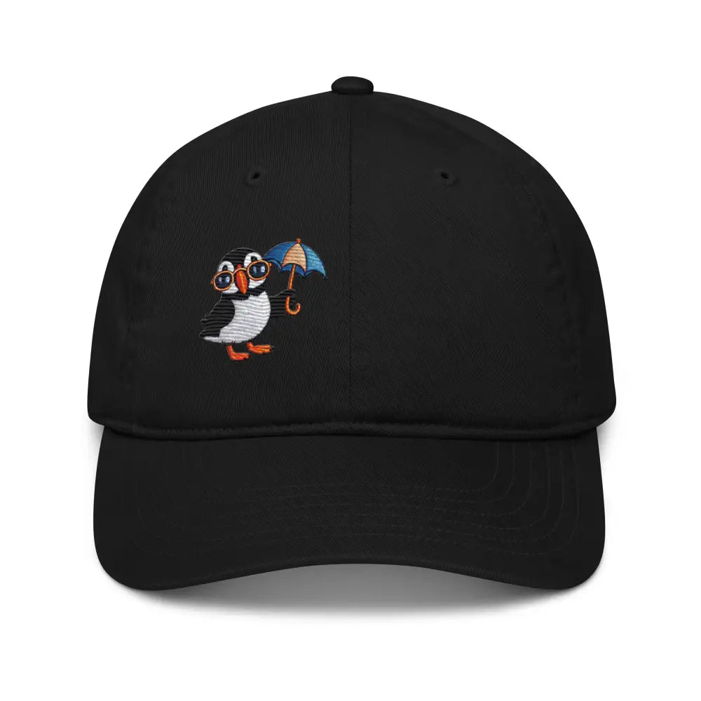 Embroidered playful puffin on organic dad hat by Trini Skies