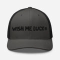 Dark gray clover trucker hat with Wish Me Luck shamrock embroidery