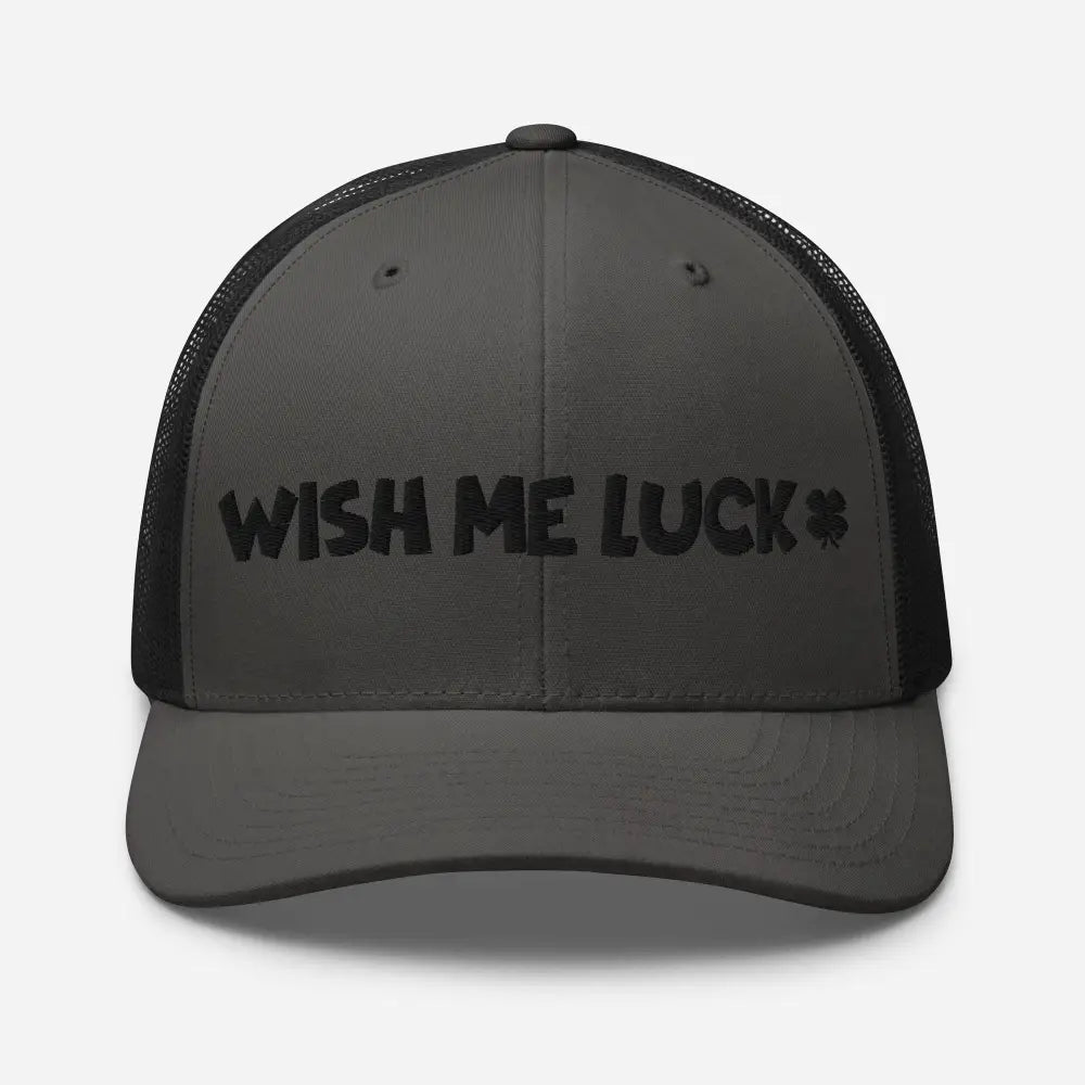 Dark gray clover trucker hat with Wish Me Luck embroidery and shamrock design