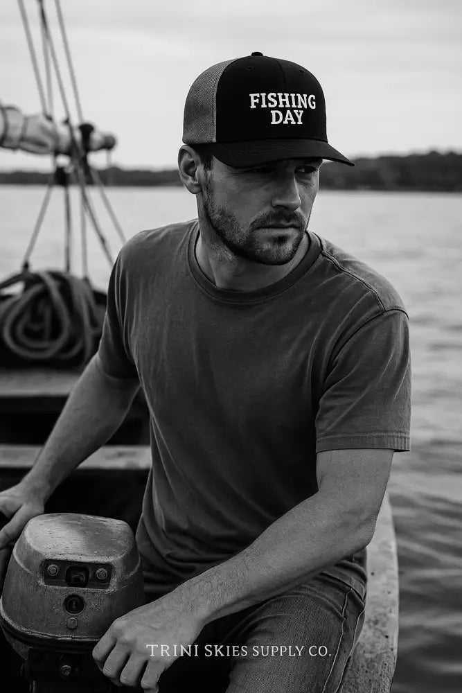 Man in black Fishing Day Richardson embroidered trucker hat
