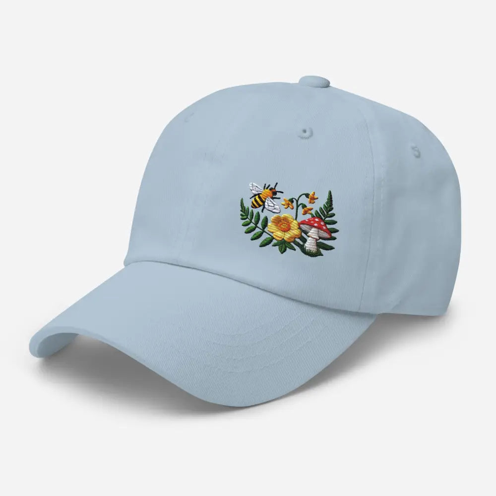 Light blue embroidered bee dad hat with flowered mushroom garden design