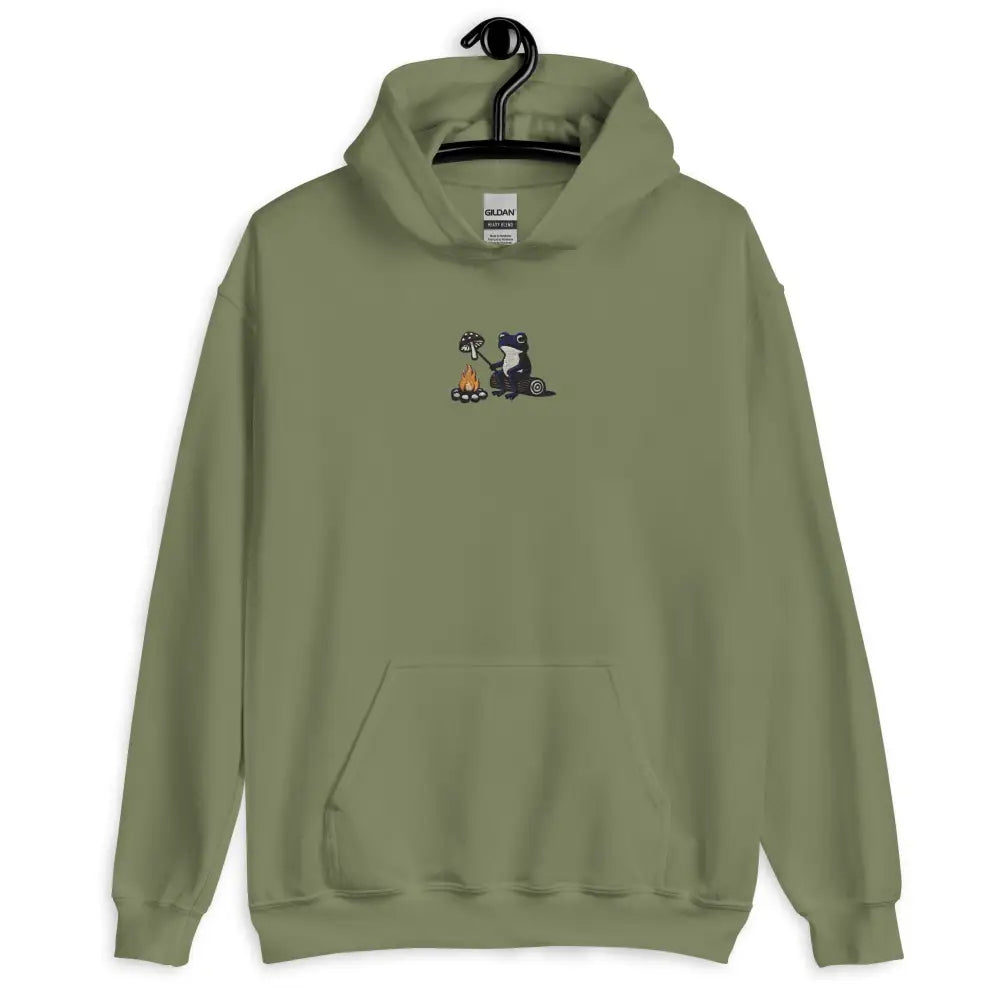 Frog by the Fire Cozy Graphic Hoodie in olive green with mushroom roasting cozy embroidery