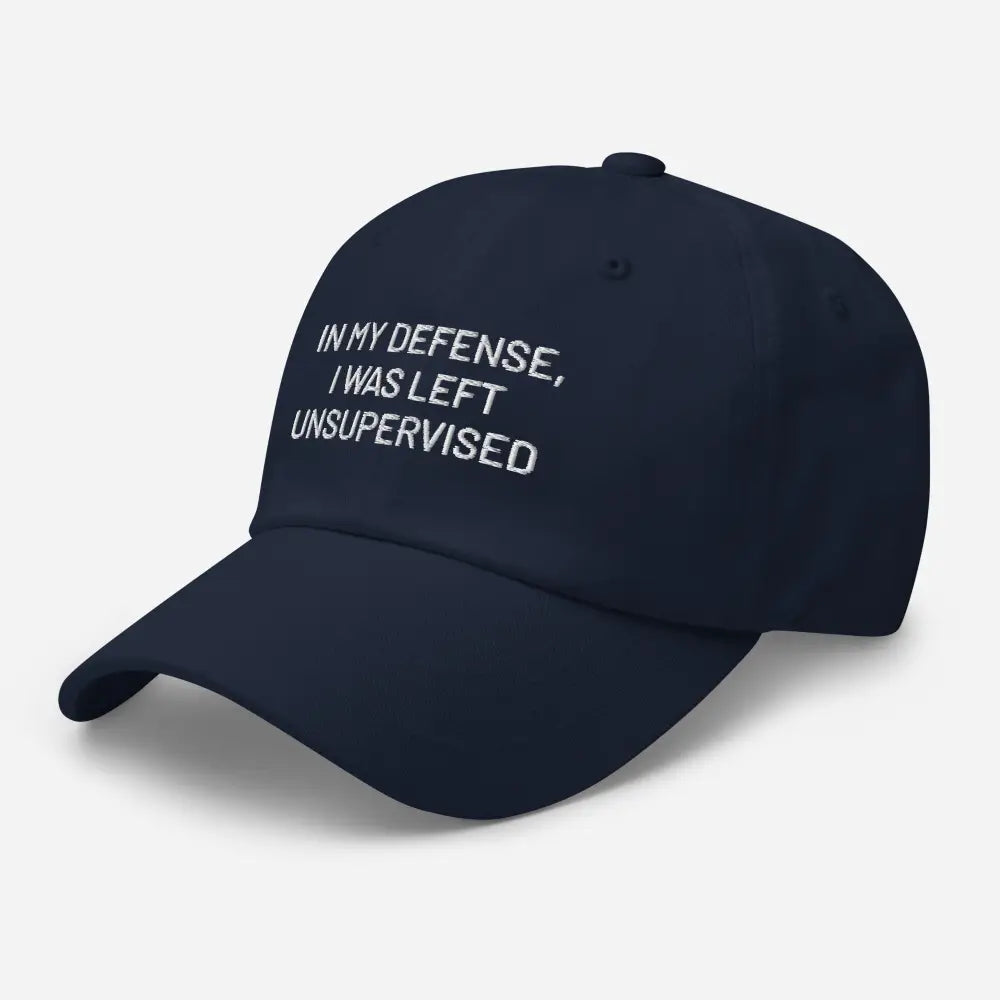 Navy blue embroidered dad hat with funny white text in my defense i was left unsupervised