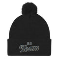 Black embroidered pom-pom beanie cozy winter hat Trini Skies