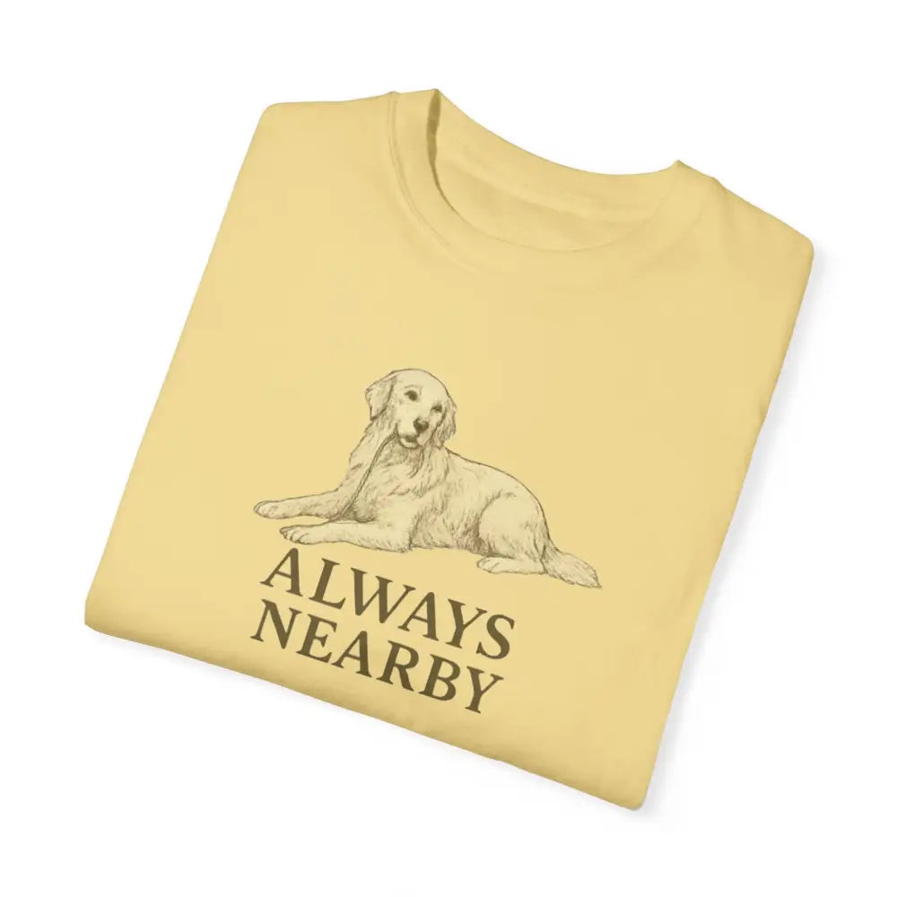 Folded light yellow unisex garment-dyed t-shirt with golden retriever graphic