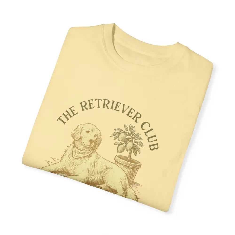 Folded unisex garment-dyed t-shirt with Golden Retriever and lemon tree graphic