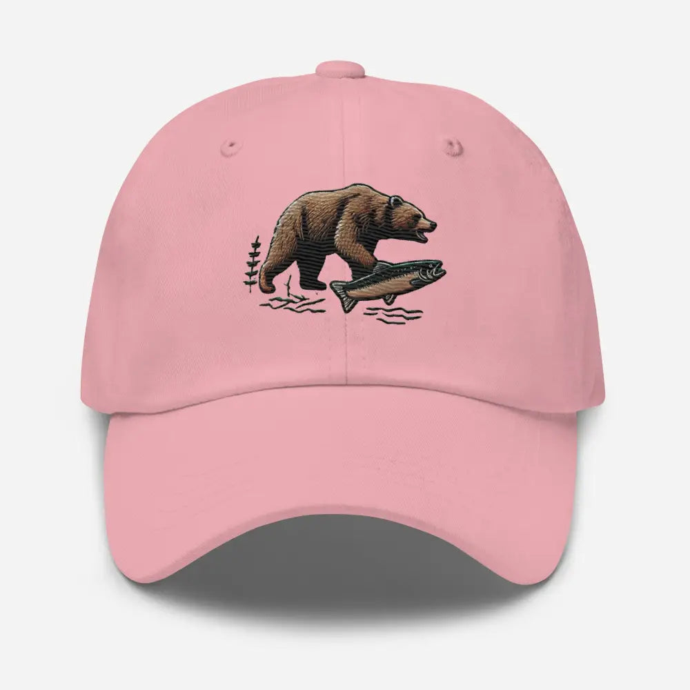 Pink cotton twill salmon dad hat with embroidered bear and fish design and adjustable antique buckle strap