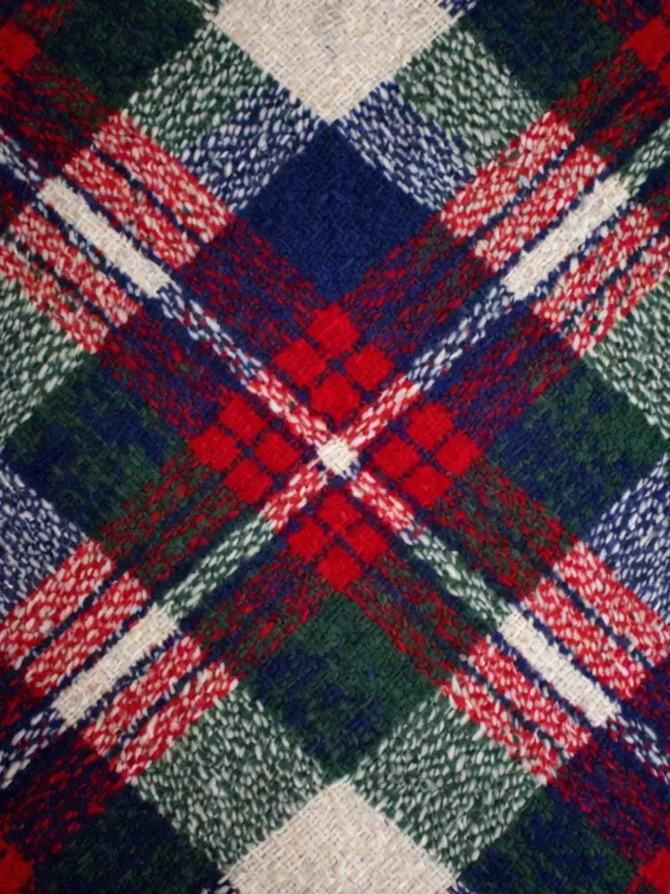 Heritage tartan woven throw blanket in red, green, navy plaid with white accents