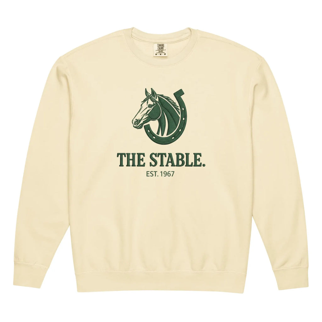 Cream-colored crewneck with stable heritage graphic of horse and horseshoe