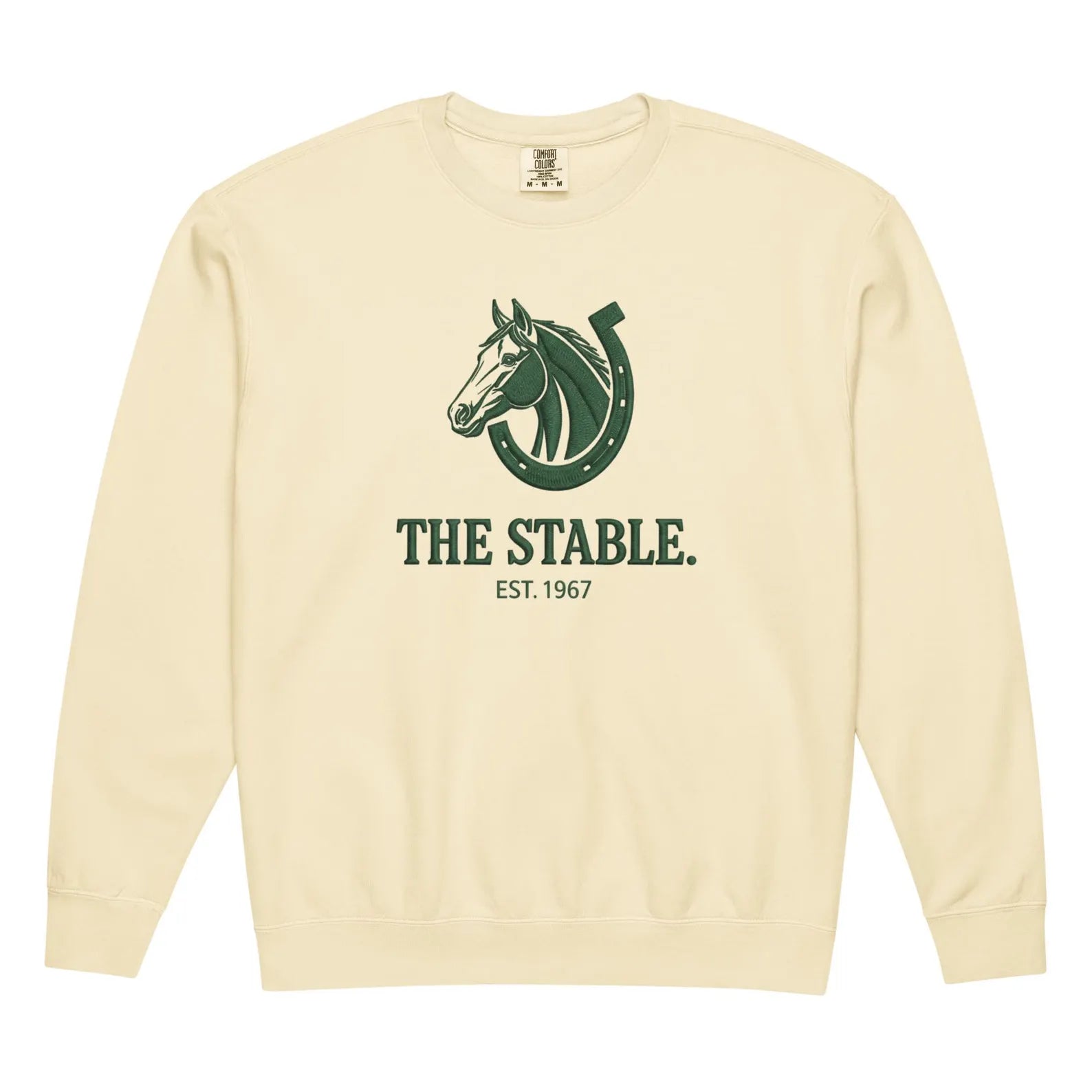 Cream-colored crewneck with stable heritage graphic of horse and horseshoe