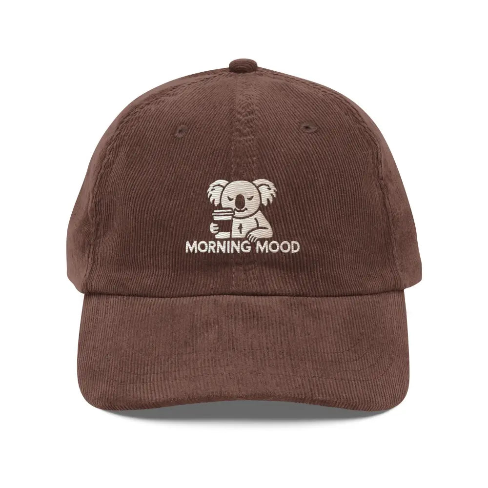 Brown embroidered corduroy cap with koala holding coffee for morning mood