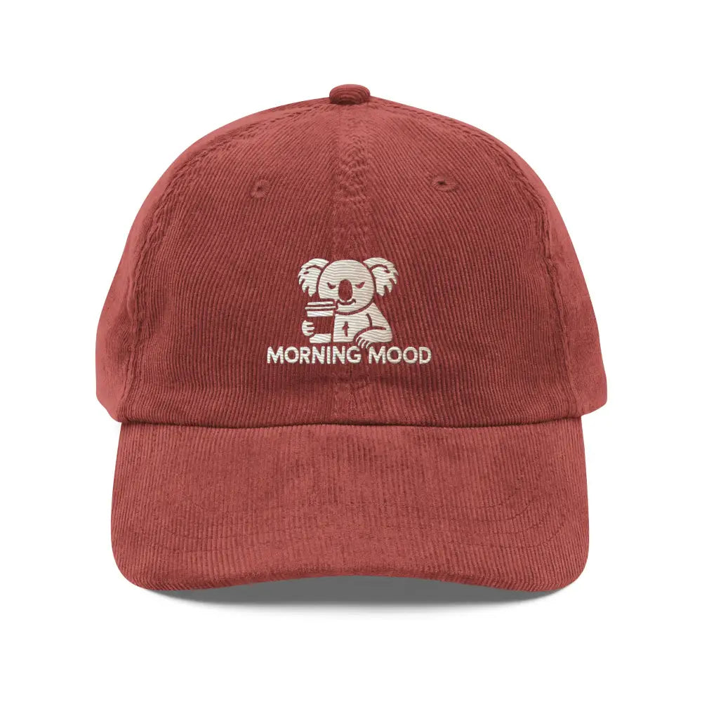 Red embroidered corduroy cap with koala holding coffee cup