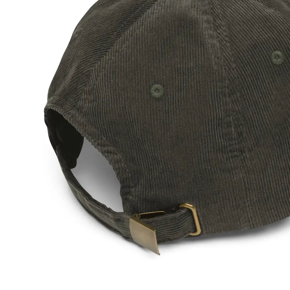 Dark green vintage corduroy cap with brass buckle closure and mushy embroidered Trini Skies