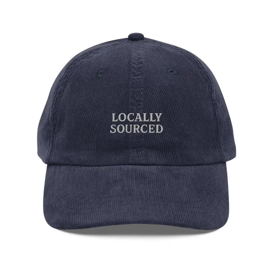 Navy blue corduroy baseball cap with locally sourced embroidered design