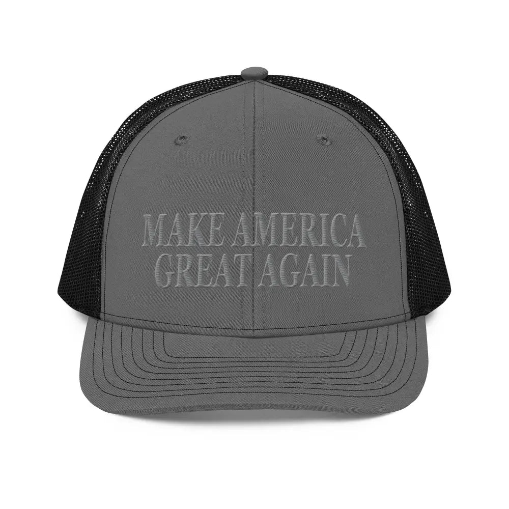 Gray trucker cap with black mesh back showcasing patriotic pride and premium MAGA hat design