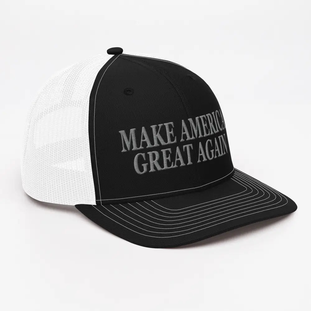 Black and white mesh trucker cap with MAGA embroidery showcasing patriotic pride
