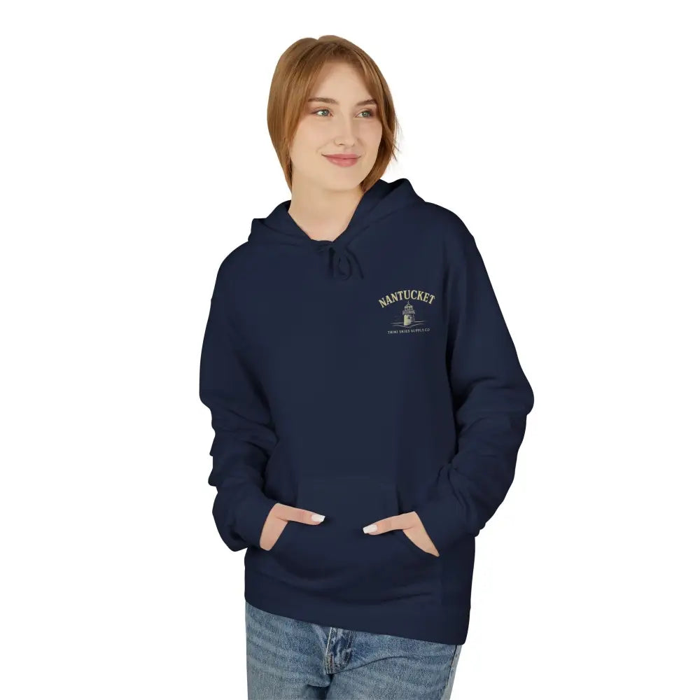 Woman wearing a dark blue Nantucket Lighthouse Coastal Graphic Hoodie with a timeless coastal charm