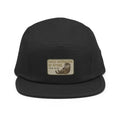 Black five-panel cap with embroidered otter patch and nylon strap clip