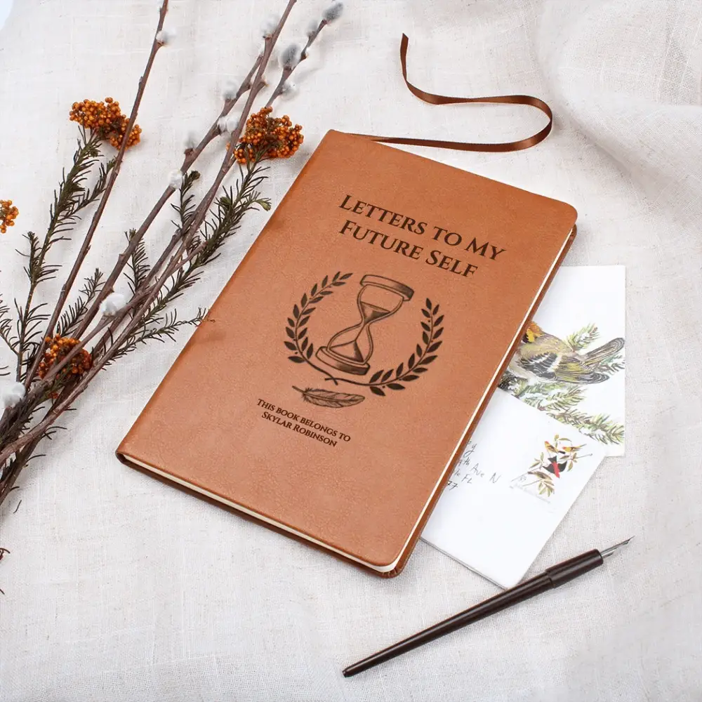 Brown vegan leather time capsule notebook with hourglass emblem