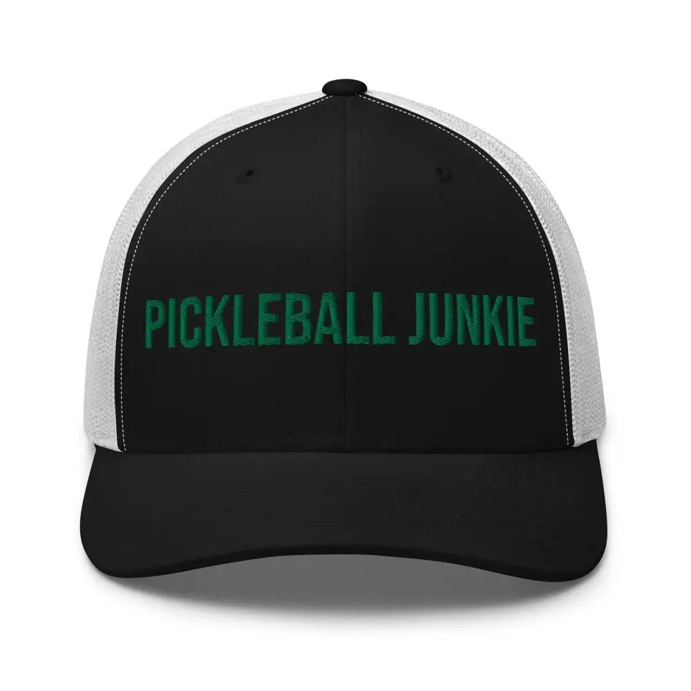 Black and white trucker hat with green embroidered pickleball junkie embroidered Trini Skies design