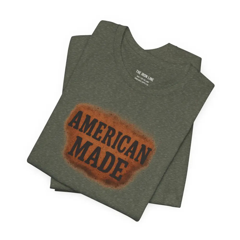 Folded olive green premium American Made graphic tee by Trini Skies Supply