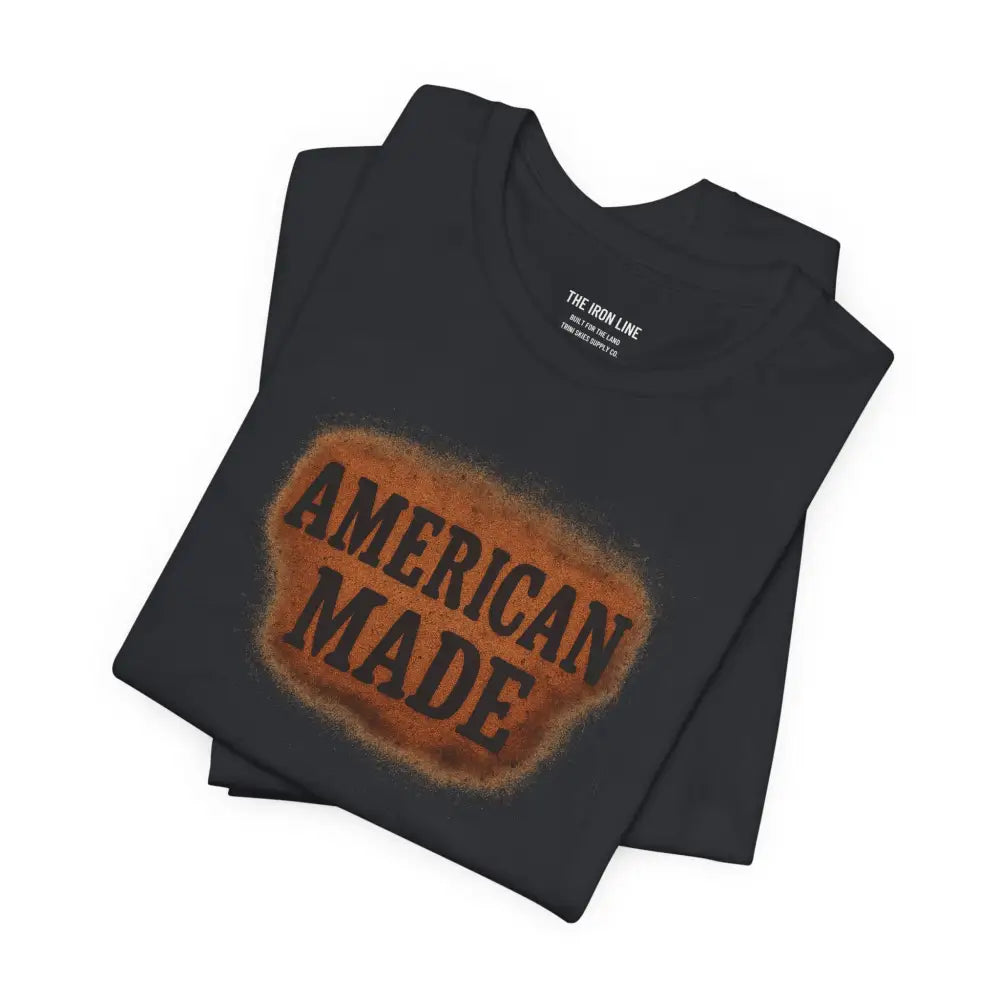 Folded black premium American Made graphic tee by Trini Skies Supply