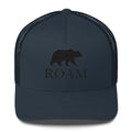 Navy blue six-panel trucker hat with Trini Skies bear silhouette and ROAM embroidery
