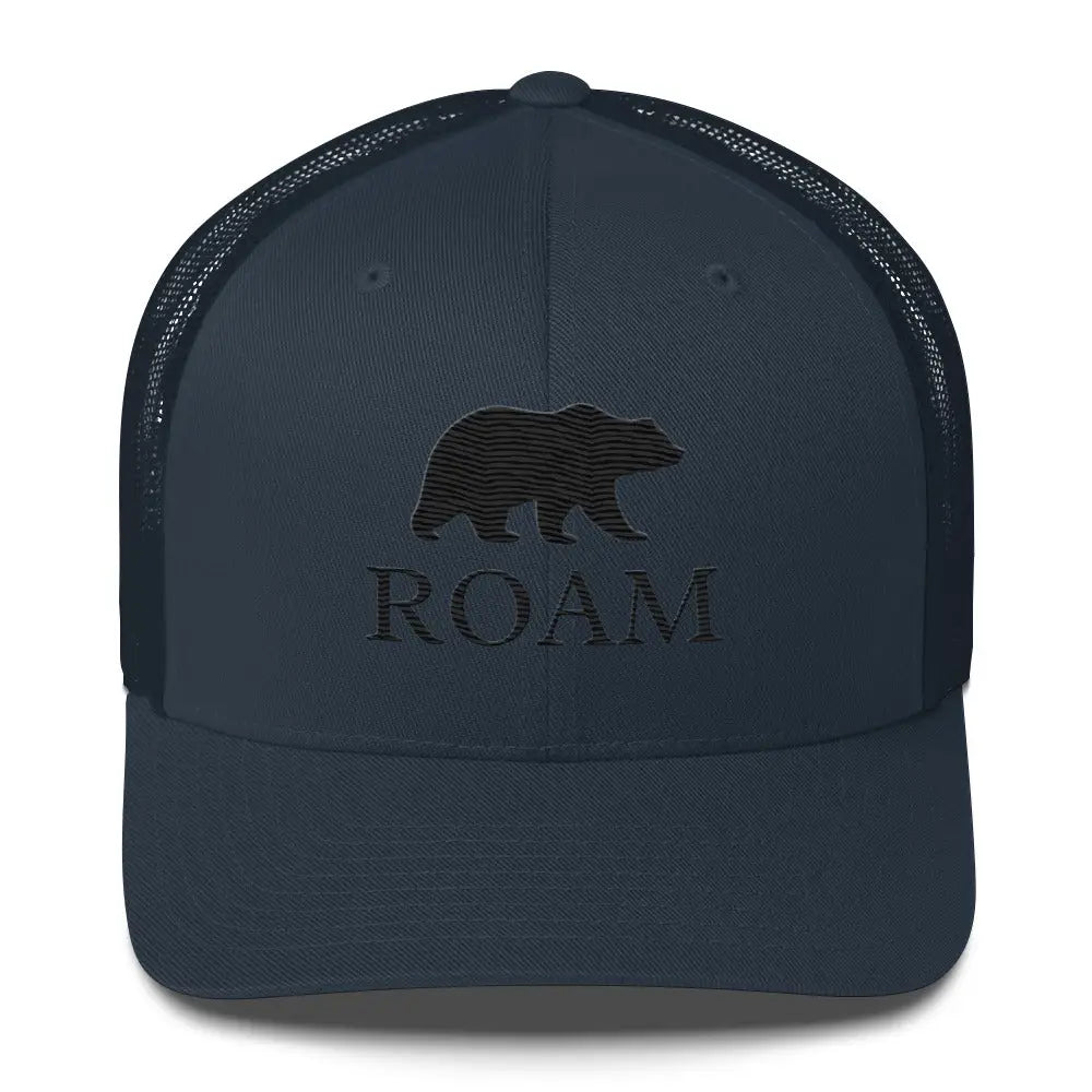 Navy blue six-panel trucker hat with Trini Skies bear silhouette and ROAM embroidery