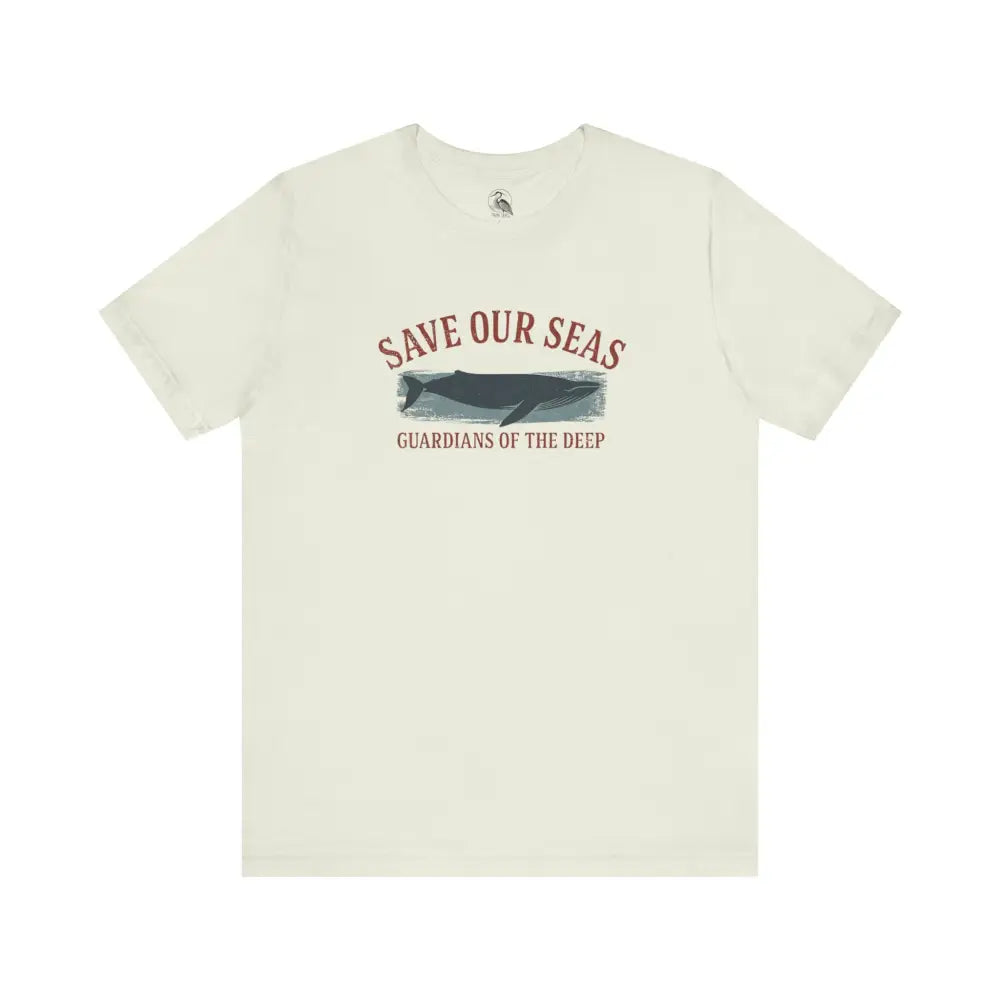 Cream-colored Trini Skies whale graphic tee with Save Our Seas text