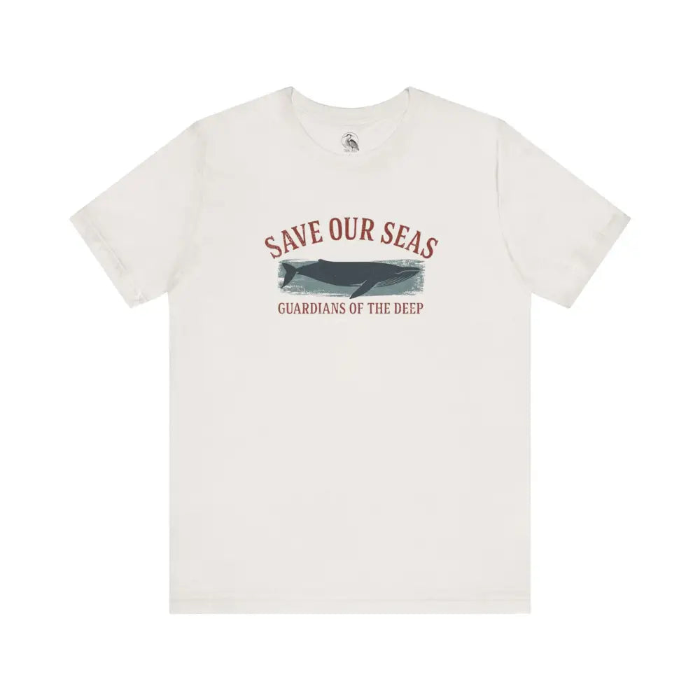 White short-sleeved Trini Skies tee with Save Our Seas whale graphic