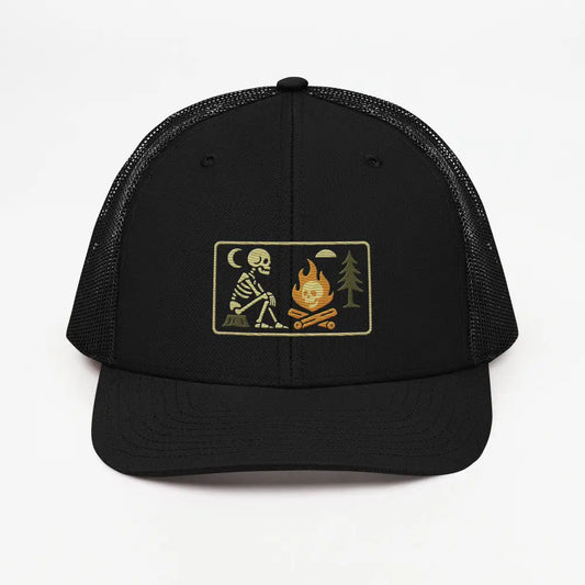 Black mesh back trucker cap with skeleton campfire embroidered patch and campfire rectangle patch