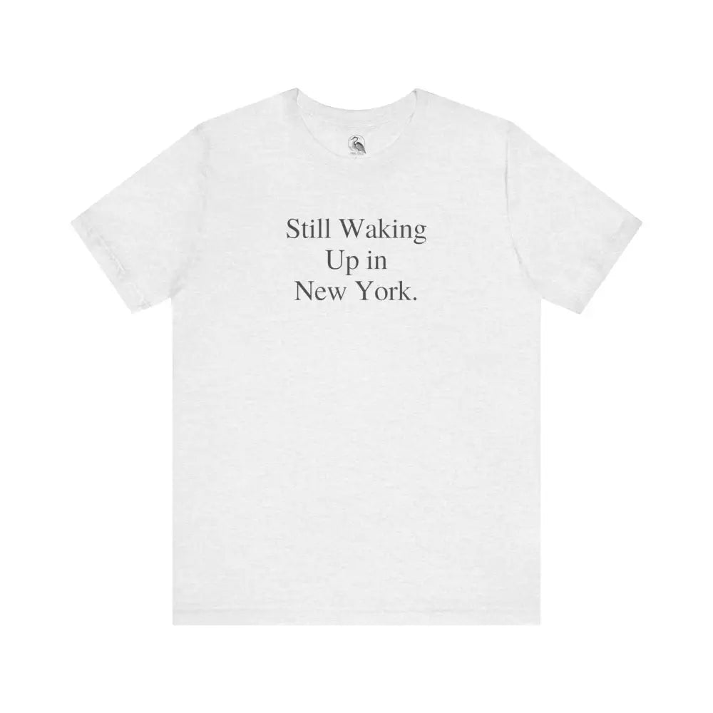 White minimalist Bella Canvas NYC tee with Still Waking Up in New York print