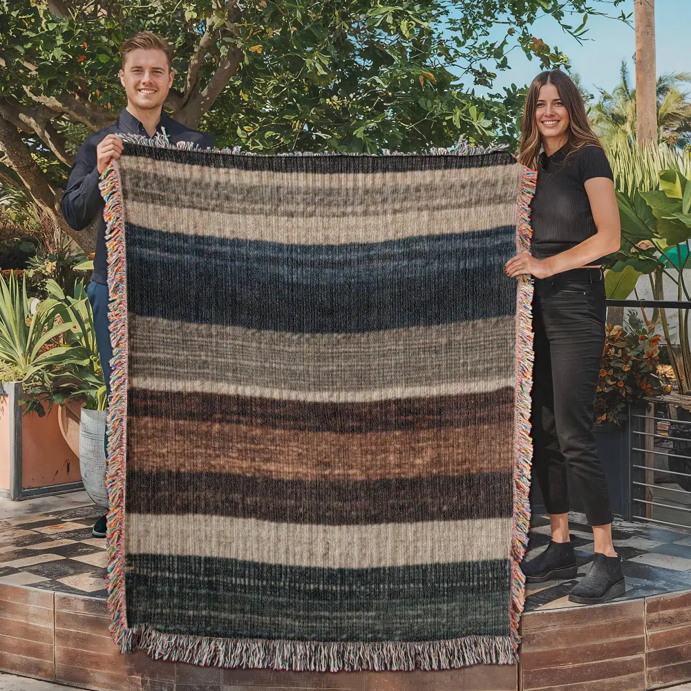Neutral lodge-inspired striped woven blanket in cotton tapestry
