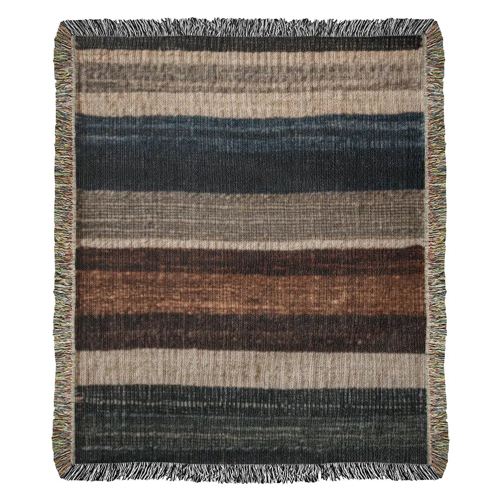 Striped woven blanket in neutral lodge-inspired cotton tapestry with earthy stripes