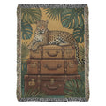 Leopard on vintage leather trunks in luxury maximalist jungle woven tapestry throw