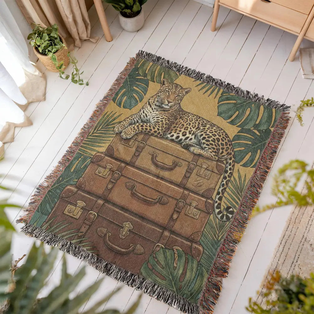 Majestic jaguar on vintage leather trunks in luxury maximalist jungle woven tapestry throw