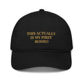 Trini Skies embroidered cotton baseball cap in black with gold text