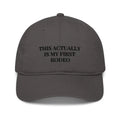Dark gray rodeo embroidered organic baseball cap with text on front