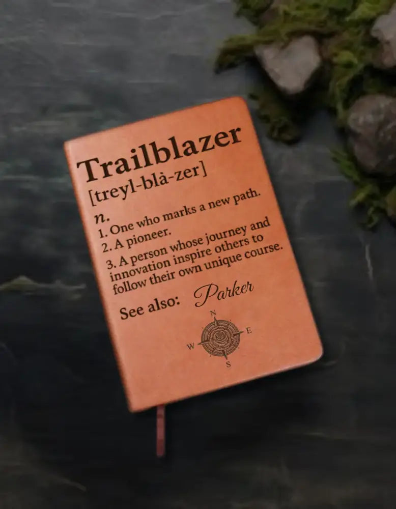 Trailblazer journal with debossed design and compass rose on orange-brown leatherette