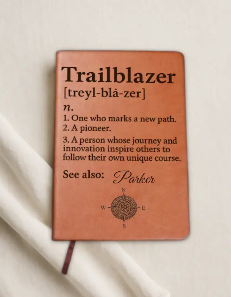 Brown leather trailblazer journal with engraved compass design