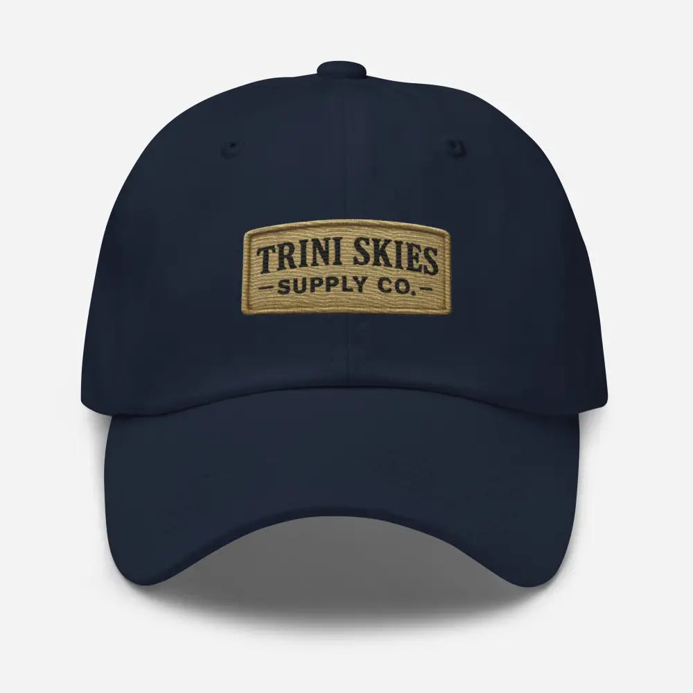 Trini Skies Heritage Patch Hat: Navy Blue Yupoong Dad Cap with Tan Embroidered Patch