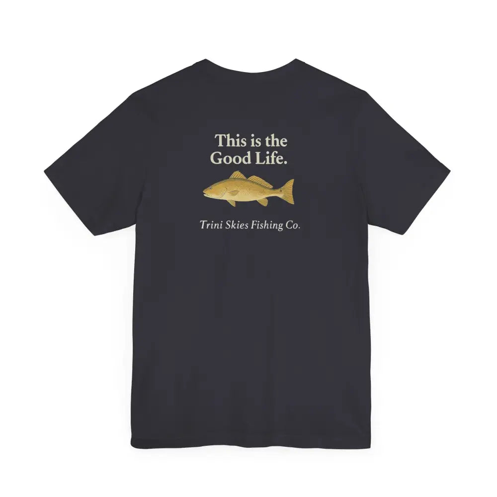 Dark gray Trini Skies Fishing short-sleeve saltwater lifestyle shirt with This Is The Good Life text and red drum fish graphic