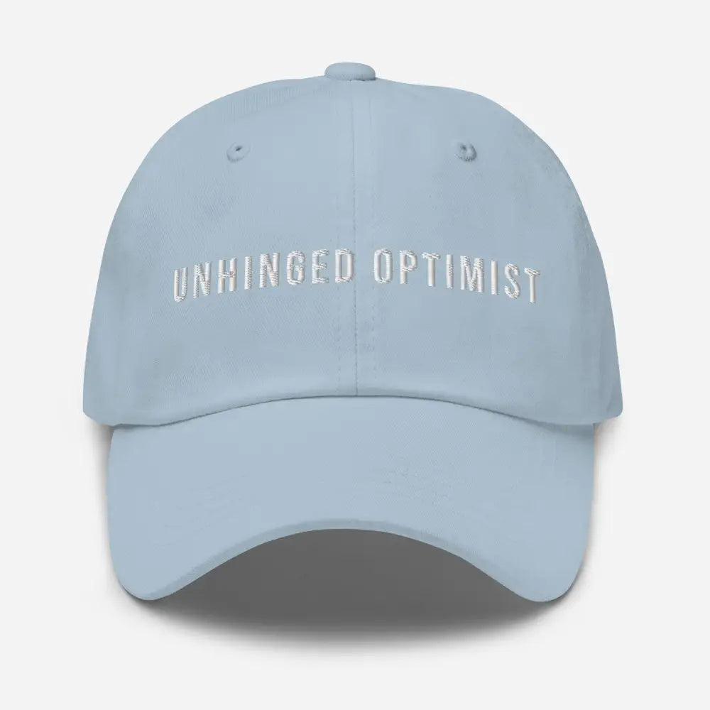Light blue Unhinged Optimist embroidered dad hat by Trini Skies Supply