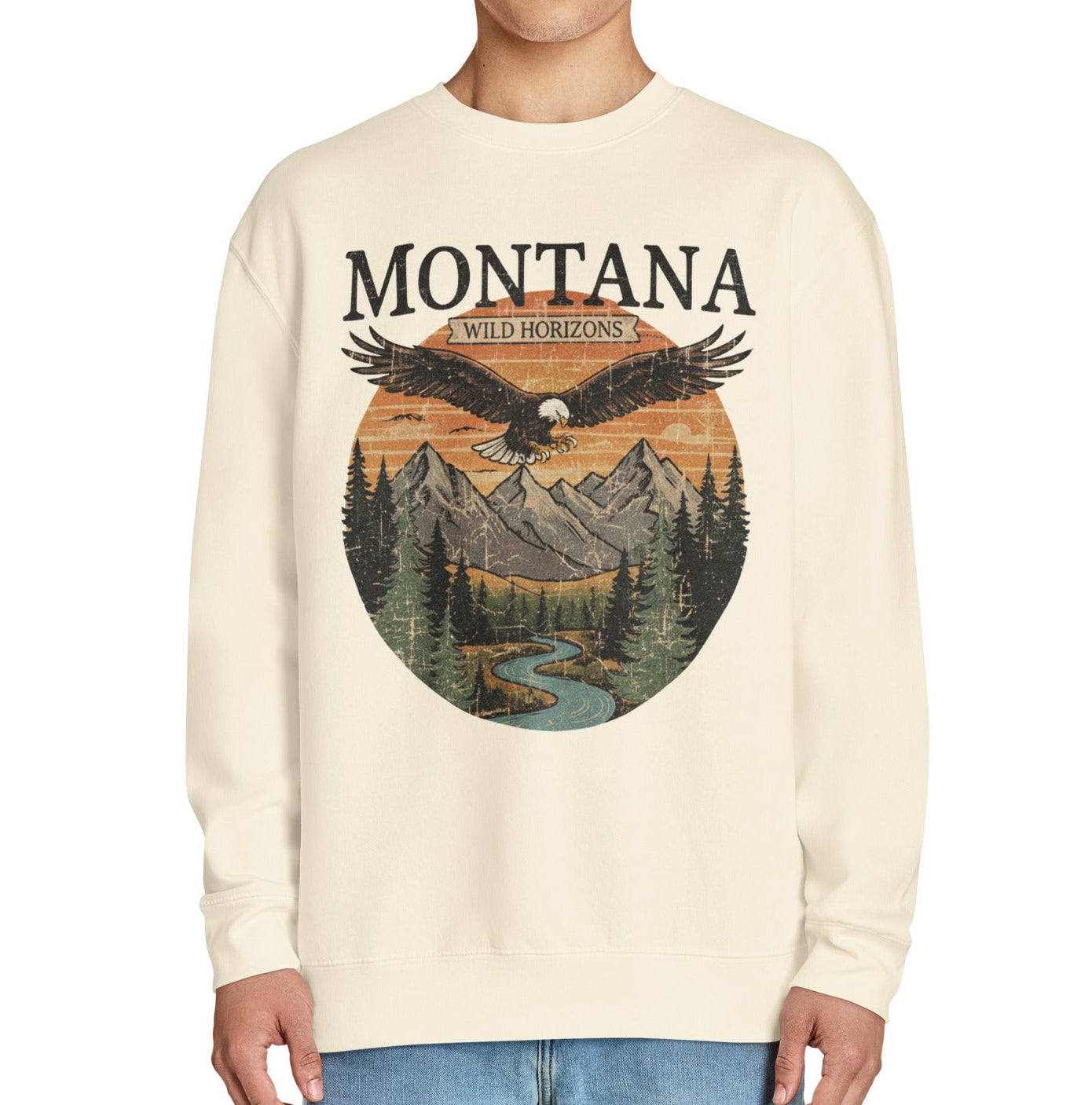 Cream-colored Montana sweatshirt with eagle mountain graphic and Wild Horizons text