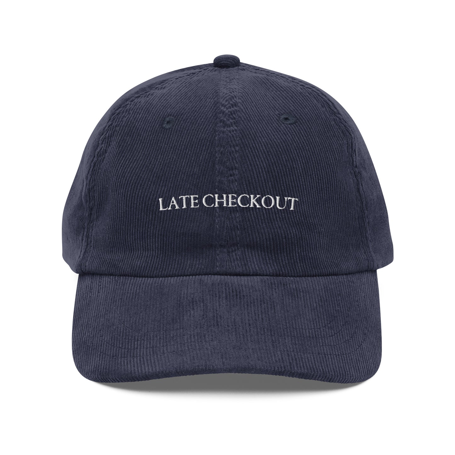 Navy blue corduroy dad cap with Late Checkout embroidery