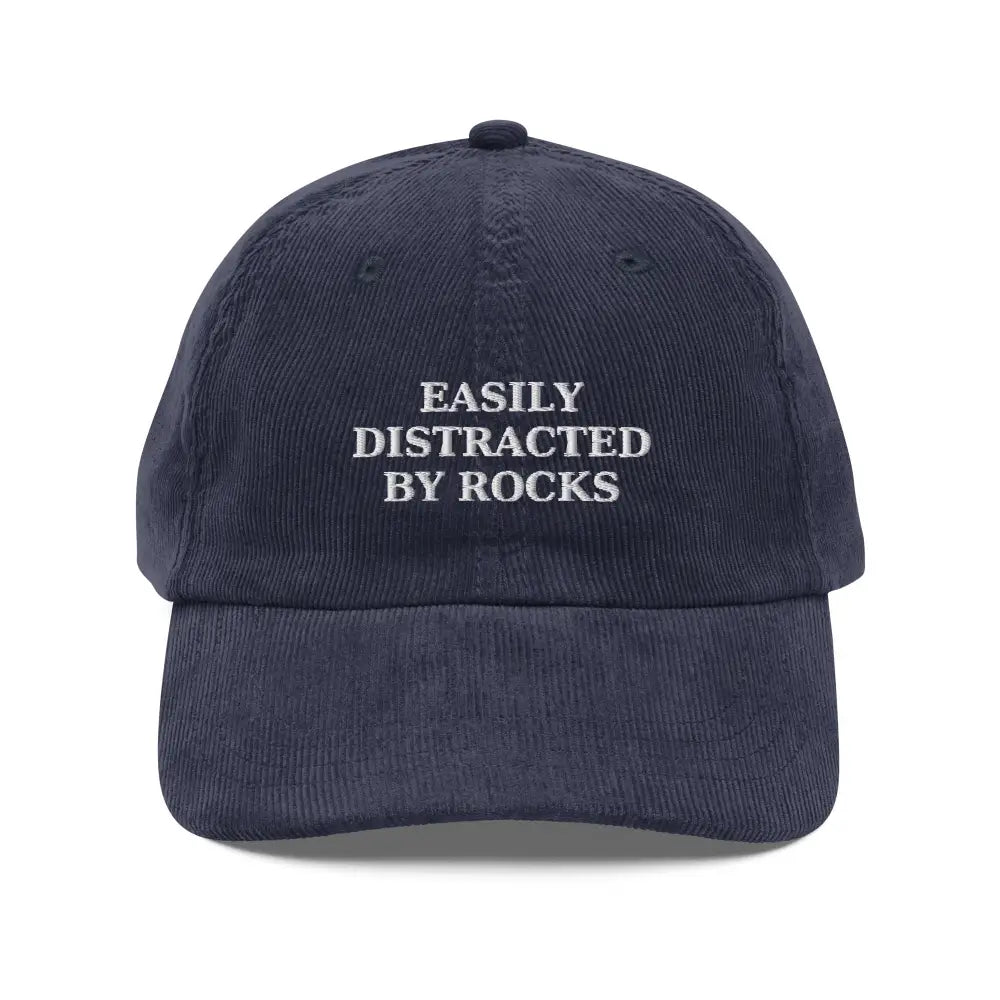 Dark blue vintage corduroy cap with white embroidered text