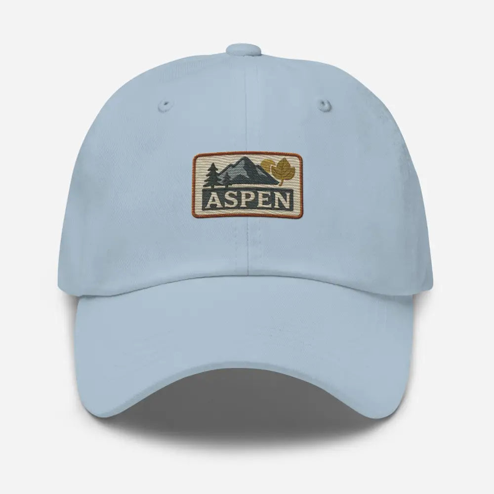 Vintage-style Aspen embroidered hat with light blue cap, mountain trees patch
