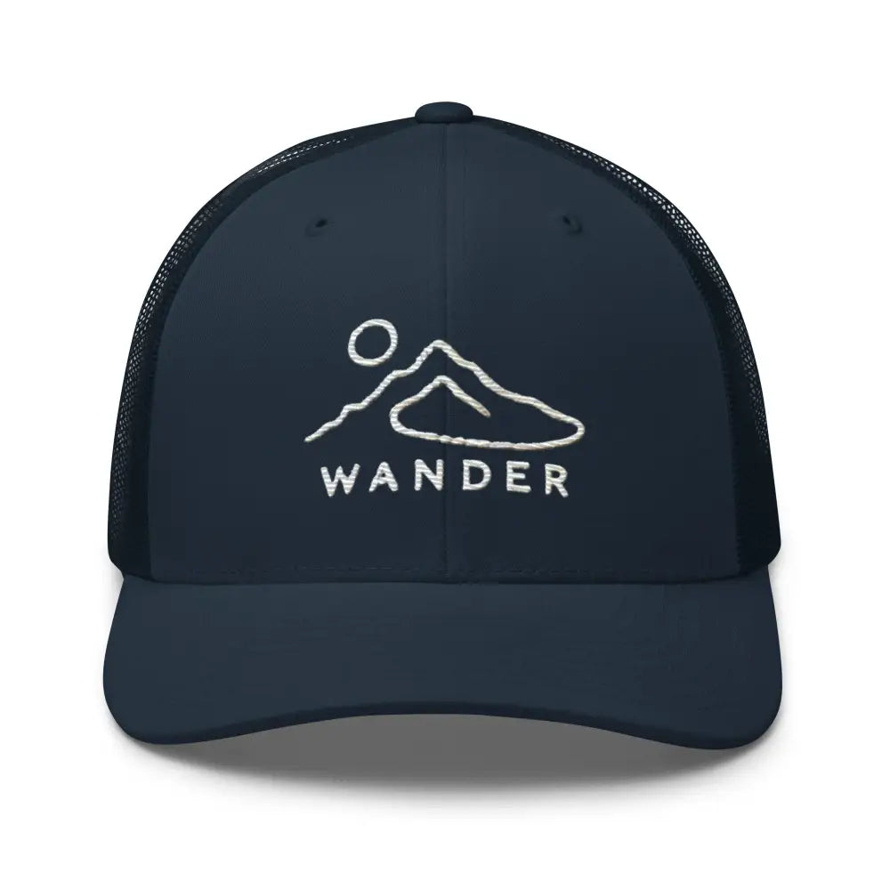 Dark blue minimalist mountain landscape trucker hat with white embroidered Wander design